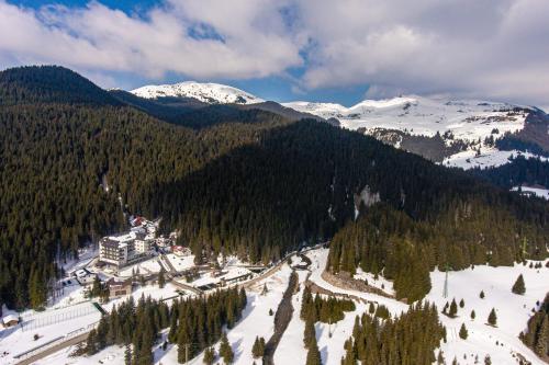 an aerial view of a ski resort in the mountains at Hotel Belmont & Spa in Sinaia