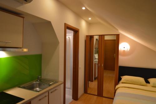 a small bathroom with a sink and a sink at GrandVille Apartments in Bucharest