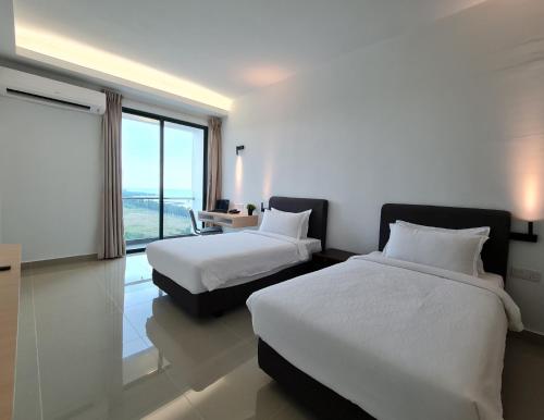 Ένα ή περισσότερα κρεβάτια σε δωμάτιο στο Swan Garden Resort Hotel