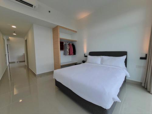Ένα ή περισσότερα κρεβάτια σε δωμάτιο στο Swan Garden Resort Hotel