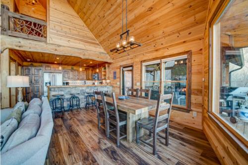 a dining room and kitchen with a table and chairs at The Hideaway in Blue Ridge