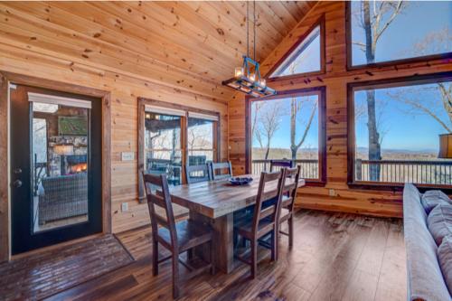 a dining room with a wooden table and chairs at The Hideaway in Blue Ridge
