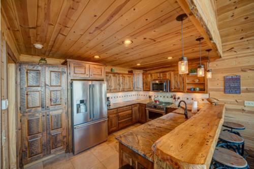 a kitchen with wooden cabinets and a large wooden counter top at The Hideaway in Blue Ridge
