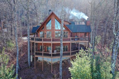 a large wooden house in the middle of the woods at The Hideaway in Blue Ridge