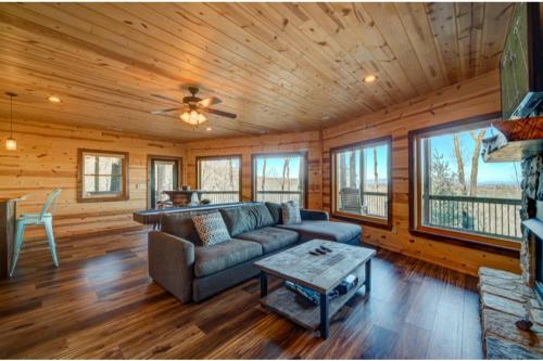 a living room with a couch and a table at The Hideaway in Blue Ridge