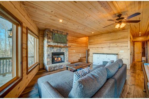 a living room with a couch and a fireplace at The Hideaway in Blue Ridge