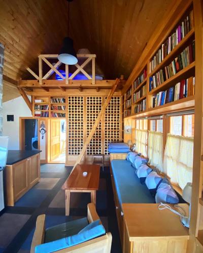a room with a bunch of seats in a library at Seosko turisticko domacinstvo Radivojevic in Čačak
