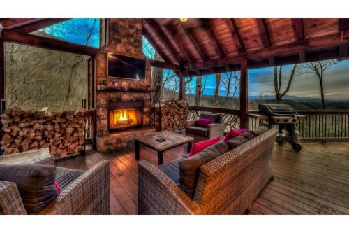 a living room with a fireplace and a couch at The Hideaway in Blue Ridge
