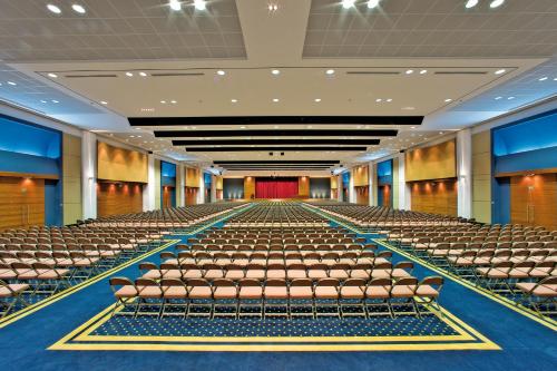 an empty auditorium with chairs and a stage at Kipriotis Village Resort in Kos Town