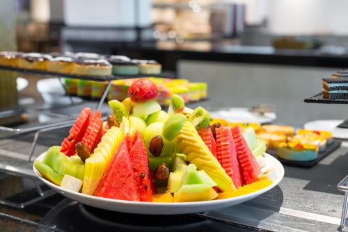 a plate of fruit on top of a counter at Hotel Borj Rabat - A member of Barceló Hotel Group in Rabat