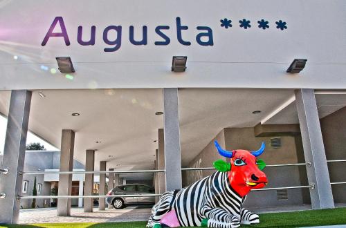 a building with a cow statue in front of it at BQ Augusta Hotel in Palma de Mallorca