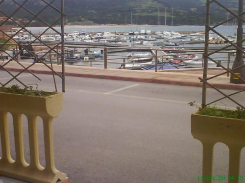 a view of a marina with boats in the water at Miramare Isola Rossa in Isola Rossa