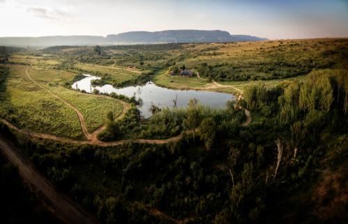 an aerial view of a river in a field at African Hills Safari Lodge & Spa in Magaliesburg