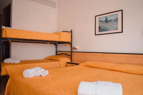 Postel nebo postele na pokoji v ubytování Hotel Admiral