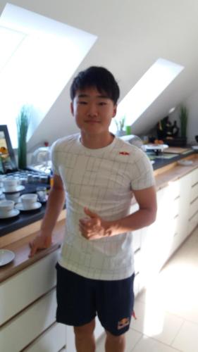 a young man standing in a kitchen at Die Schlafstube - Bed & Breakfast in Zeltweg