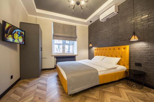 a bedroom with a large bed and a window at Central Dayflat Apartments in Kyiv