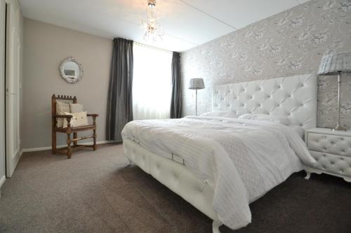 Katil atau katil-katil dalam bilik di Costa Del Katwijk