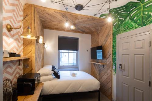 a room with two beds and a window and a door at Blok-74 in Brighton & Hove