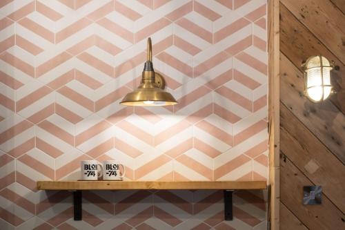 a room with a pink and white geometric wall at Blok-74 in Brighton & Hove