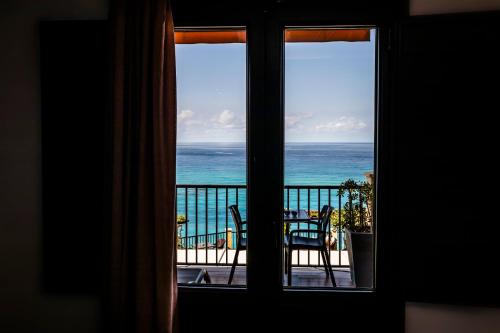 a view of the ocean from a window at Hotel Rocca Della Sena in Tropea
