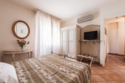 Ένα ή περισσότερα κρεβάτια σε δωμάτιο στο Residence Isola Verde Cisanello