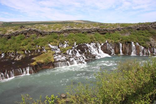a waterfall in the middle of a river at Cabin 3 at Lundar Farm in Varmaland
