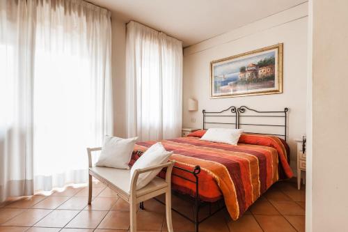 Ένα ή περισσότερα κρεβάτια σε δωμάτιο στο Residence Isola Verde Cisanello