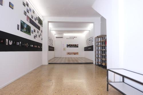 a hallway of an art gallery with white walls at Piano Tre in Verona
