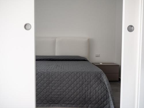 Postel nebo postele na pokoji v ubytování Resilienza Apartment