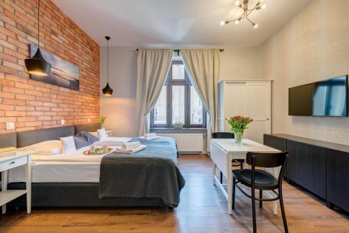Ένα ή περισσότερα κρεβάτια σε δωμάτιο στο Apartamenty Bema4 Sopot