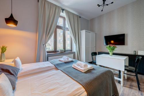 Ένα ή περισσότερα κρεβάτια σε δωμάτιο στο Apartamenty Bema4 Sopot