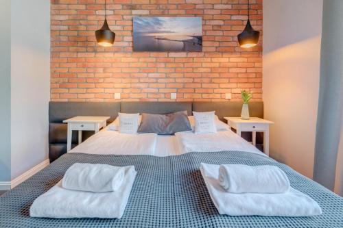 Ένα ή περισσότερα κρεβάτια σε δωμάτιο στο Apartamenty Bema4 Sopot