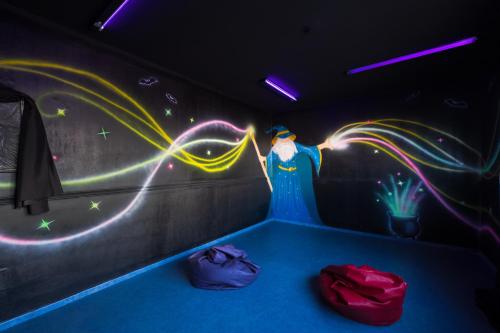 a room with a wall with lights on it at Apartamentos Galeon Playa in Costa Teguise