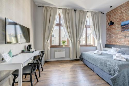 Ένα ή περισσότερα κρεβάτια σε δωμάτιο στο Apartamenty Bema4 Sopot