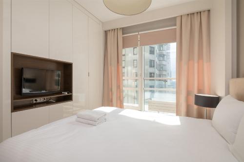Posteľ alebo postele v izbe v ubytovaní Grzybowska Platinum Apartment Tower A