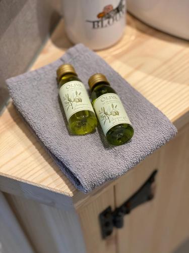 two bottles of wine sitting on top of a table at Luxury Chalets Monnickendam in Monnickendam