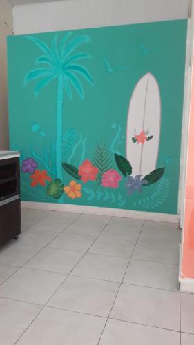 a room with a wall with a mural of a surfboard at Hotel Atlantic in Mar del Plata
