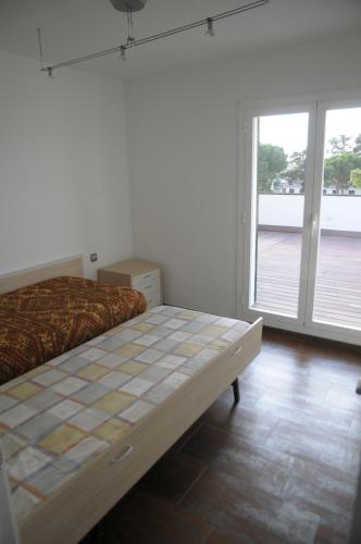 En eller flere senge i et værelse på Encantador apartamento en S'Agaró-Platja de Aro