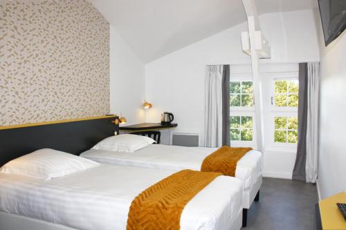 Postel nebo postele na pokoji v ubytování Hôtel du Parc & Spa