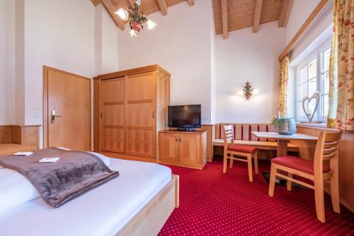 TV a/nebo společenská místnost v ubytování Apparthotel Sonnenhof