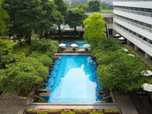 an overhead view of a swimming pool in a building at Royal Ambarrukmo Yogyakarta in Yogyakarta