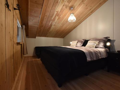 Ένα ή περισσότερα κρεβάτια σε δωμάτιο στο Lovely Holiday Home in Nistelrode near Lake