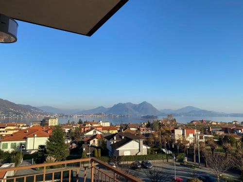 a view of a city from a balcony at Appartamento Golfo Borromeo 1 Baveno in Baveno