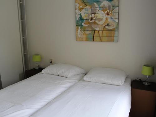 Llit o llits en una habitació de Resort Mooi Bemelen 9