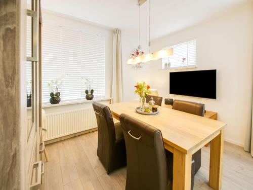 a dining room with a table and chairs at Rustic Holiday Home in Kilder with Garden in Kilder