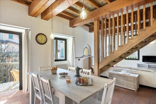a kitchen and dining room with a table and chairs at I Balconi in Iseo