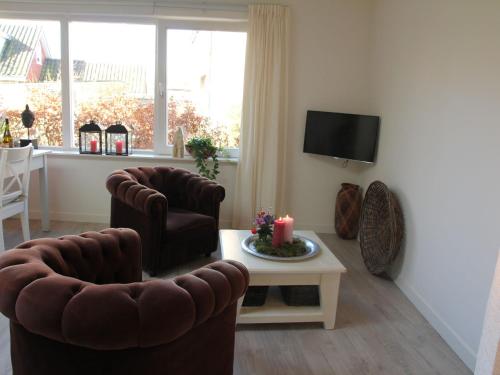 Μια τηλεόραση ή/και κέντρο ψυχαγωγίας στο Apartment in Bergen near Schoorl Dunes