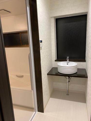 Ένα μπάνιο στο 佐渡民宿 憩 IKOI GUEST HOUSE & Cafe Bar