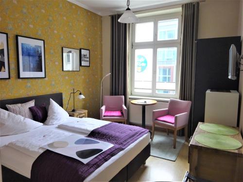Postel nebo postele na pokoji v ubytování Hotel Pension Zur Fährbrücke