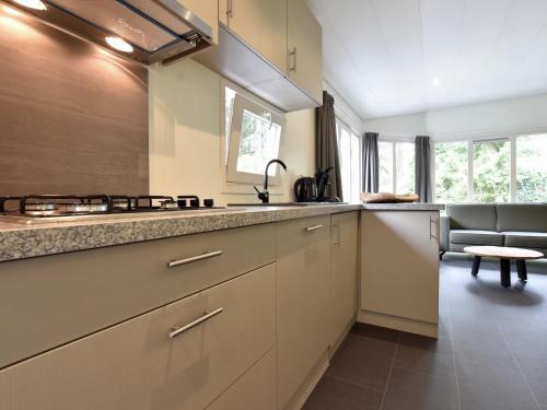 a kitchen with a sink and a counter top at Stylish Stay in Vorden Woods in Vorden